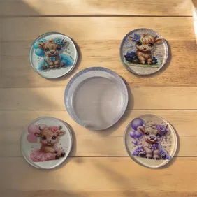 Resin highland cow coaster set with base. Each coaster features a different highland cow #highlandco