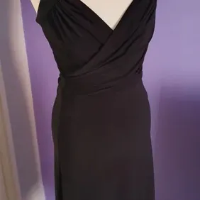 Loose black dress made of Laycra, tied at the neck, new without tags