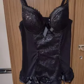 Lovely Black Sequinned Lingery Size 36c. Has padded bra cups adjustable straps soft mesh body with s