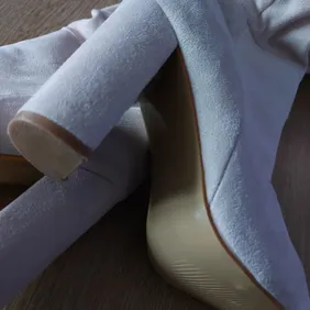 Beige suedette knee high ruched boots with 4" heels! Worn less than an hour so basically brand new.