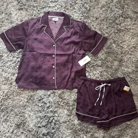  purple DKNY Women's Boxer Short Sleeve Pyjama Set with a satin finish and white piping details.