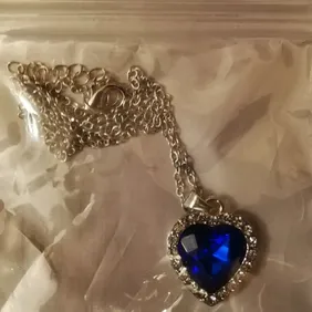 Royal blue heart shaped pendant necklace. Never worn.