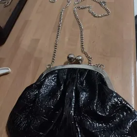 black and silver shoulder bag shiny black soft material bag with silver chain strap only used once