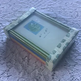 Pack of 4 Picture Frames 4” x 6” Green, Blue, Yellow, Red.  Can be wall-mounted or standing.  Unused