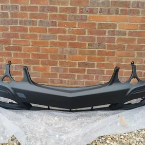 Brand new genuine Mercedes E Class W211 facelift front bumper 2006 - 2009 and supporting backing bra