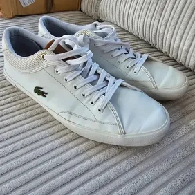 Mens Lacoste trainers. Size 9.5 UK Worn but still in good condition and very comfortable.