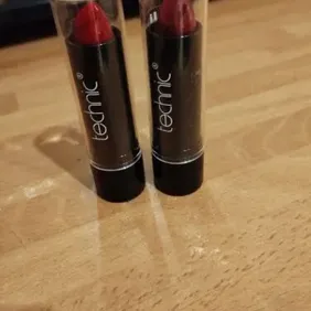 2 technic lipsticks one red one dark red never used