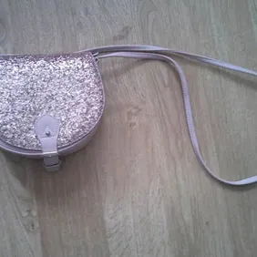 Girls small, pink, glittery handbag with faux buckle and popper closure on the bottom. Originally fr