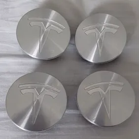 4 Centre Caps Alloy Wheels Tesla 56mm Silver Genuine Colour 