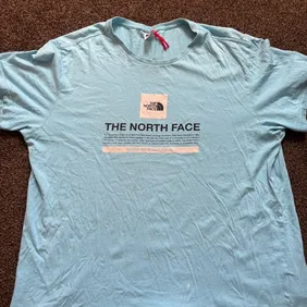 The North Face Tee Blue Size XL Small Dot Probably Gone after a Clean on back of shirt and Bleach Ma