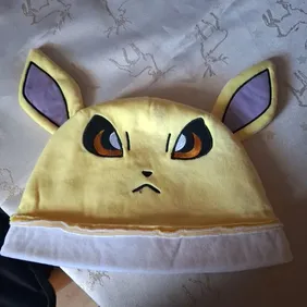 Electric Jolteon Pokémon Hat - Vibrant YellowEmbrace your inner trainer with this vivid yellow Jolte