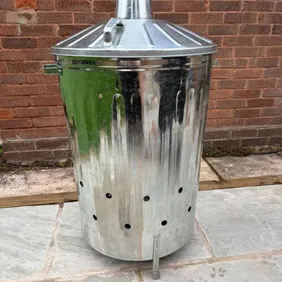 Brand new, boxed 125L galvanised steel fire bin / incinerator. Ideal for safely burning garden waste
