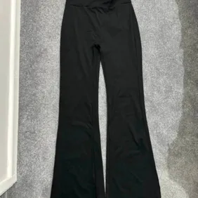 Chic Black Flared Trousers with TikTok Bum - Size M. No labelling or branding.