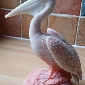 Pelican, pink stone carving. quality ornament