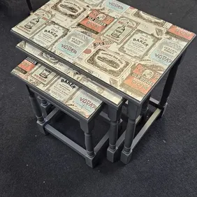 Set of three side tables pained with Frenchic Smudge chalk paint and decoupaged table tops.