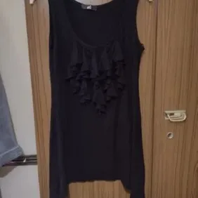 black long ruffly top size 10 nice black long top longer at the sides with ruffle on the top worn a 