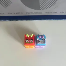 Dual Clickeez Fidget Toys - Red & Blue Tops with Purple & Orange BasesRelieve stress with a pair of